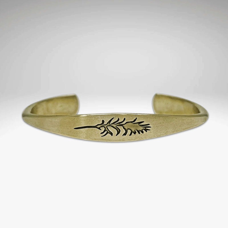 Paintbrush Signet Cuff in antique brass finish showcasing a leaf design, adjustable, handmade in Montana.