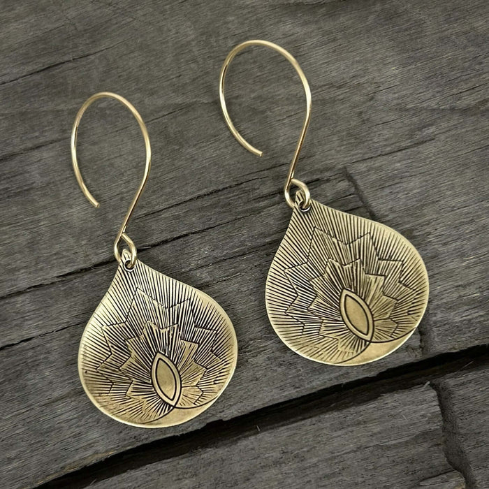 Petals Earrings in antique brass finish, showcasing delicate floral design on teardrop shape.
