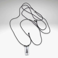Pine Tree Necklace on a black cord, featuring a Ponderosa Pine Tree pendant design.