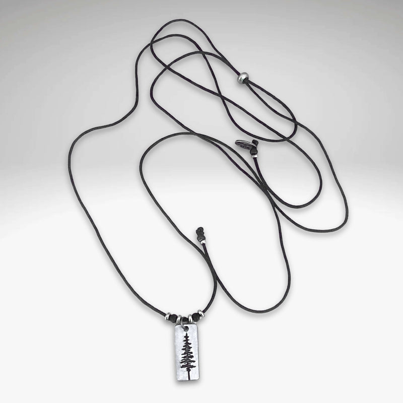 Pine Tree Necklace on a black cord, featuring a Ponderosa Pine Tree pendant design.