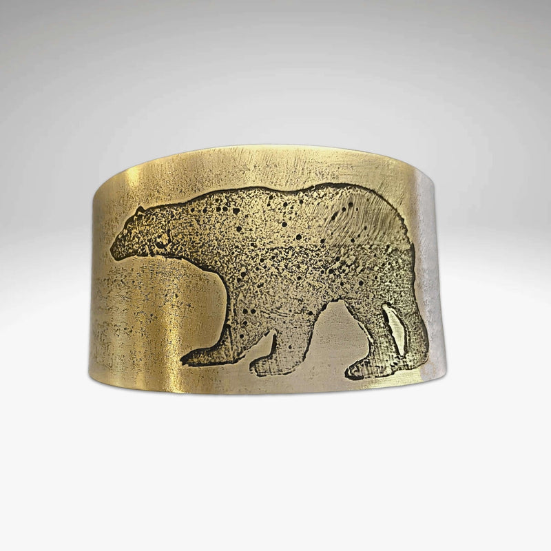 Polar Bear Cuff made from raw brass with a unique etched polar bear design, showcasing a rustic style.