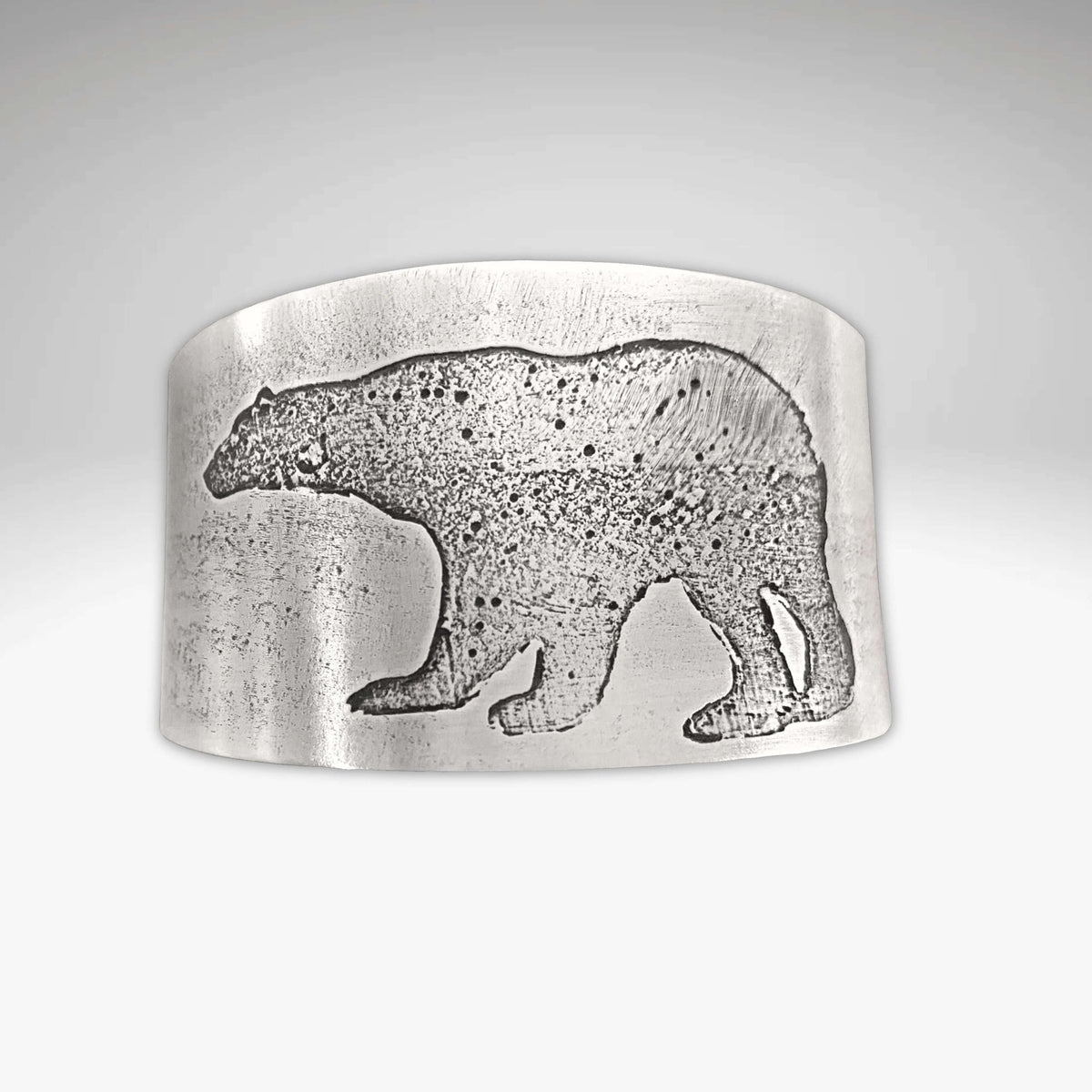 Polar Bear Cuff crafted from raw brass with etched polar bear design, textured for realism and uniqueness.