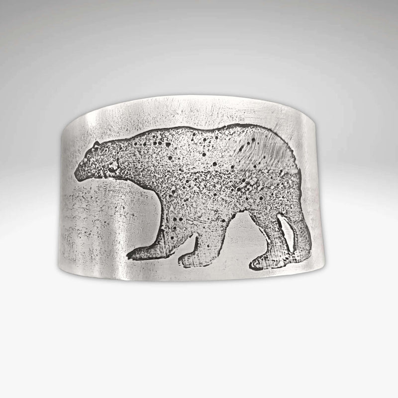 Polar Bear Cuff crafted from raw brass with etched polar bear design, textured for realism and uniqueness.
