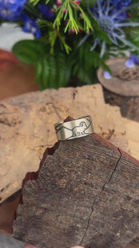 Mountain Goat adjustable ring on wood, featuring a nature-inspired design, perfect for outdoor enthusiasts.