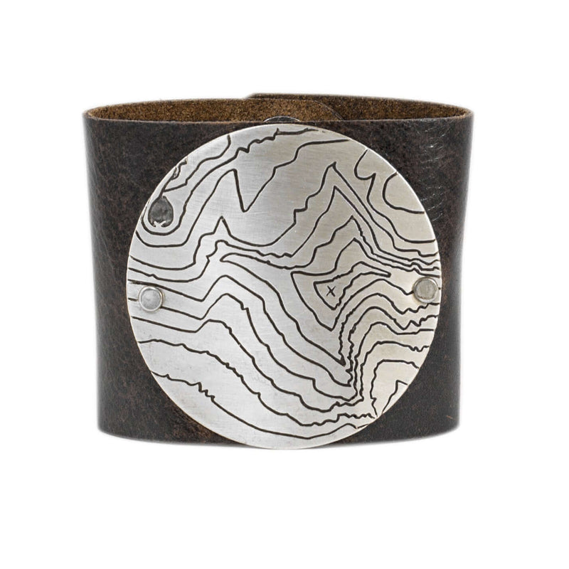 Rising Wolf Disk Leather Cuff with topographical design in classic Espresso leather, featuring a matte silver finish.