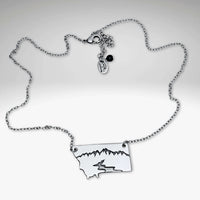 River Run Necklace depicting Montana's mountains and river, perfect for outdoor enthusiasts and nature lovers.