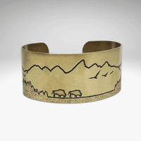 Roaming Buff on the Range Cuff Bracelet showcasing bison silhouette against a mountain backdrop.