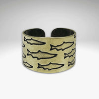 Salmon Run Adjustable Ring featuring raw brass with etched salmon designs, perfect for fish lovers and outdoor enthusiasts.