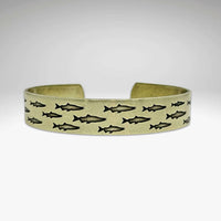 Salmon Run Cuff Bracelet featuring vivid salmon designs in a handmade metal cuff, perfect for nature enthusiasts.