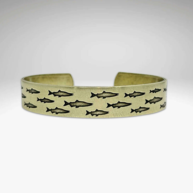 Salmon Run Cuff Bracelet featuring vivid salmon designs in a handmade metal cuff, perfect for nature enthusiasts.