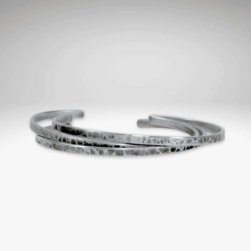 Set of Three Thin Cuff Bracelets in Matte Silver finish with a textured hammered design.