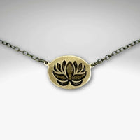 Simple Lotus Necklace featuring a beautifully etched lotus design on raw brass with a delicate chain.