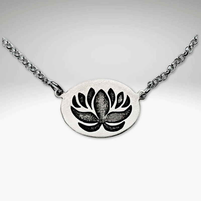 Simple Lotus Necklace featuring a detailed lotus pendant on a silver chain, perfect for layering or wearing alone.