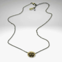 Simple Lotus Necklace featuring a small raw brass lotus pendant on a delicate chain.