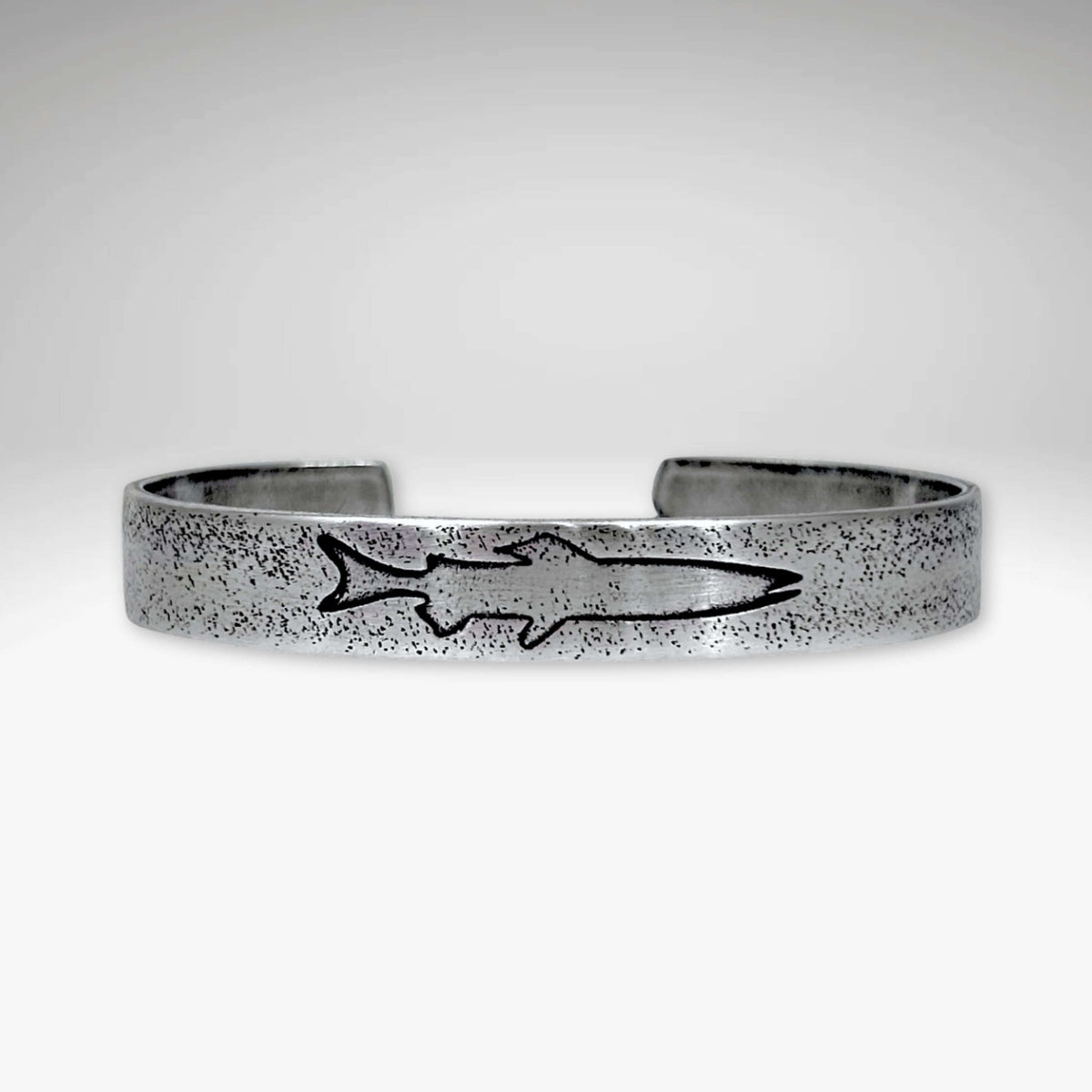 Single Trout Cuff Bracelet featuring a sleek design with a trout engraving on a silver cuff.