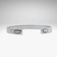 Skinny Bear Cuff Bracelet featuring bear engravings, 1/4" wide with a unique hammered texture.