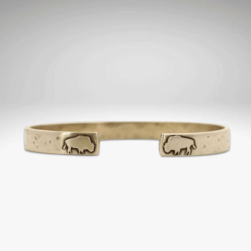 Skinny Buff Cuff Bracelet featuring an etched bison design on raw brass with a textured finish.