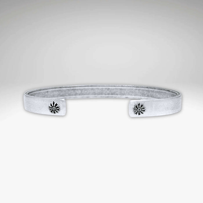 Skinny Bitterroot Flower Cuff Bracelet in matte silver with floral accents, adjustable and handmade in Montana.