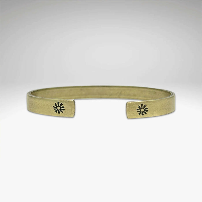 Skinny Bitterroot Flower Cuff Bracelet in antique brass finish with floral design, handmade in Montana.