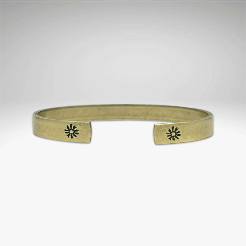 Skinny Bitterroot Flower Cuff Bracelet in antique brass finish with floral design, handmade in Montana.