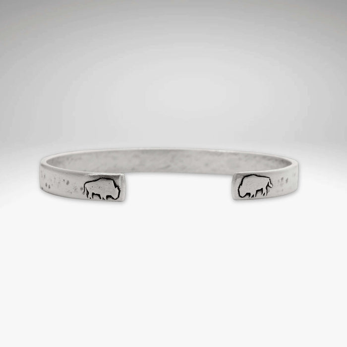 Skinny Buff Cuff Bracelet featuring bison etchings, showcasing raw brass craftsmanship.