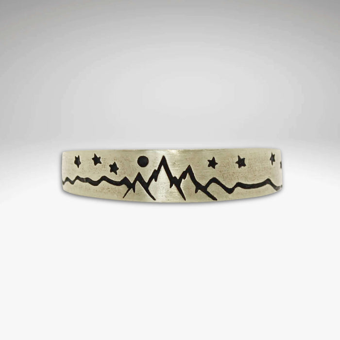 Skinny High Alpine Adjustable Ring showcasing mountains and stars design on a smooth band.