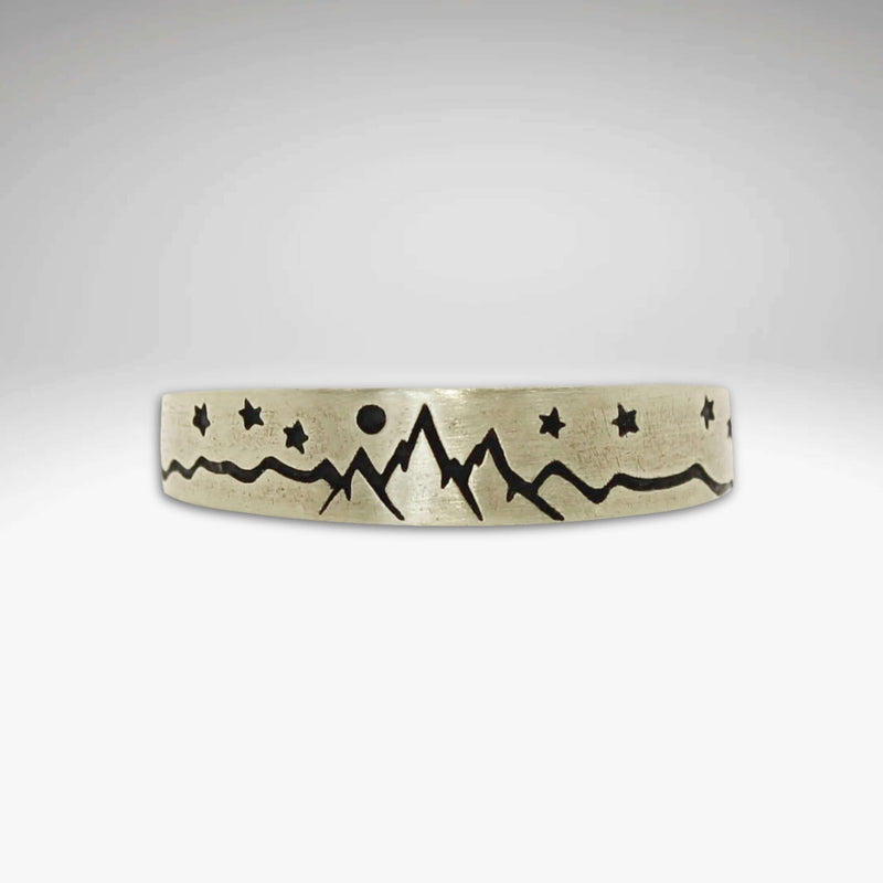 Skinny High Alpine Adjustable Ring showcasing mountains and stars design on a smooth band.