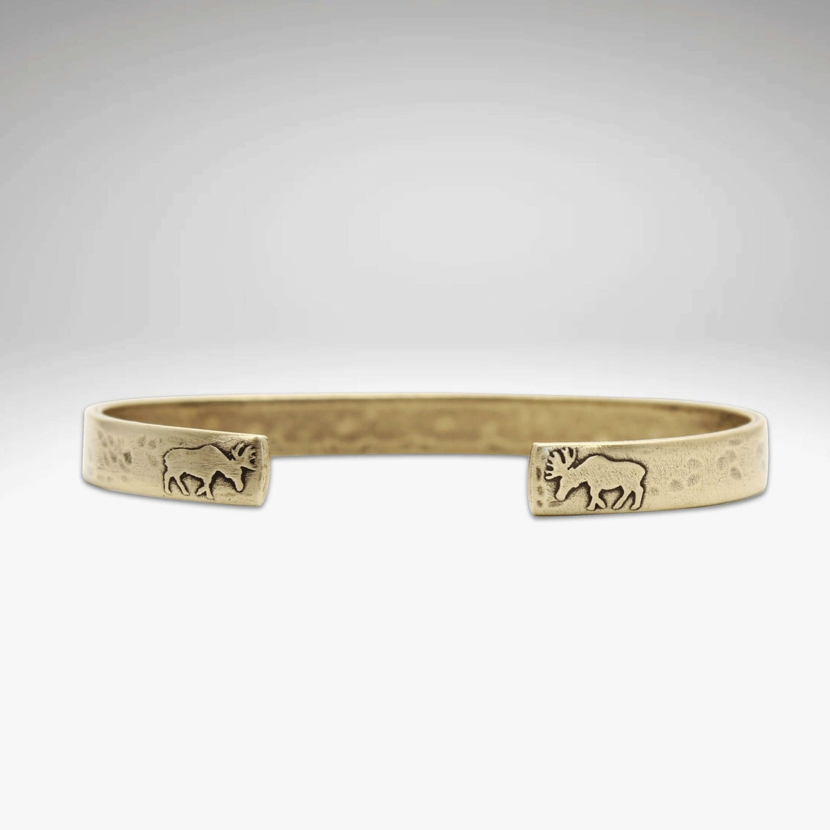 Skinny Moose Cuff Bracelet featuring moose designs on the tips, made of raw brass, perfect gift for moose lovers.