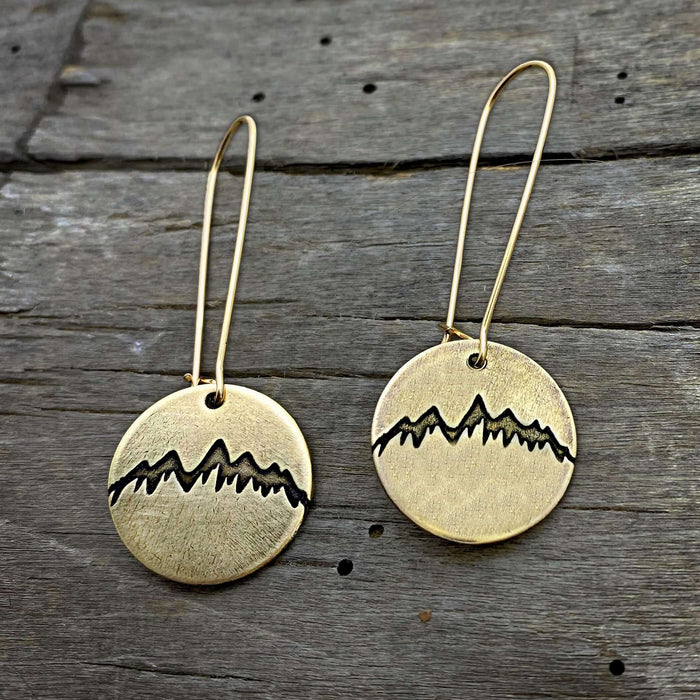 Snowcap Mountain Earrings featuring snowcapped peaks on elegant round disks with long kidney earwires.