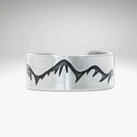Snowcaps Adjustable Ring featuring etched mountain design in Matte Silver finish.