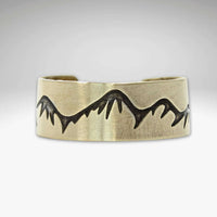 Snowcaps Adjustable Ring featuring an etched mountain design in high-quality raw brass.