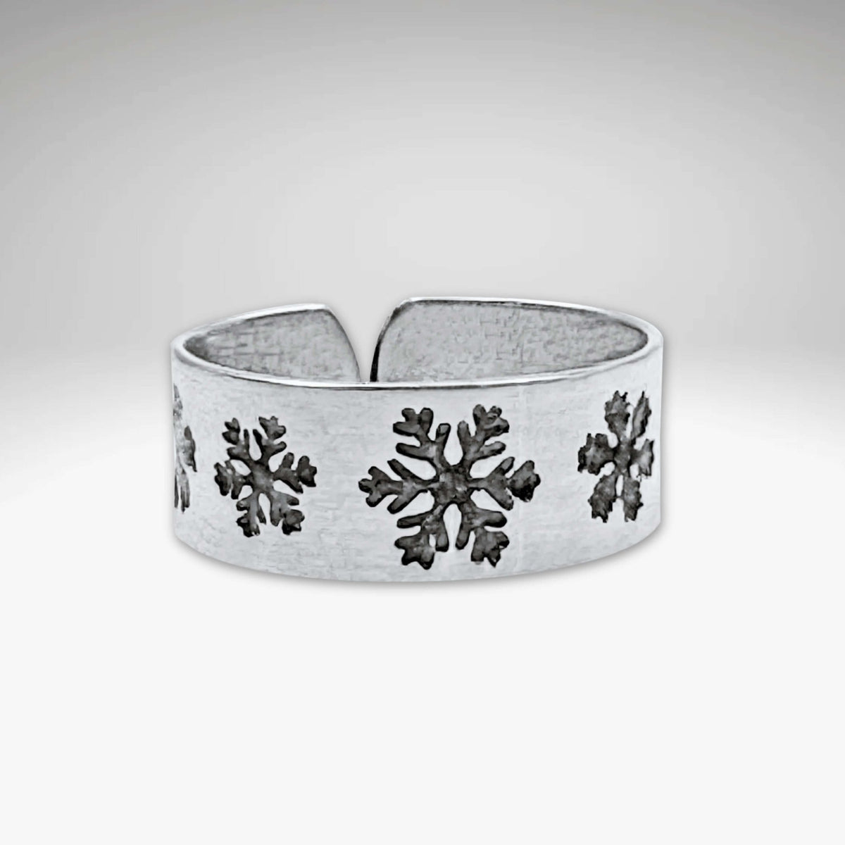 Snowfall Adjustable Ring featuring unique etched snowflakes in Matte Silver finish.