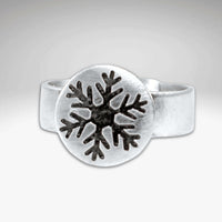 Snowflake Adjustable Ring featuring a handmade snowflake design on a 1/2" disk and adjustable band.