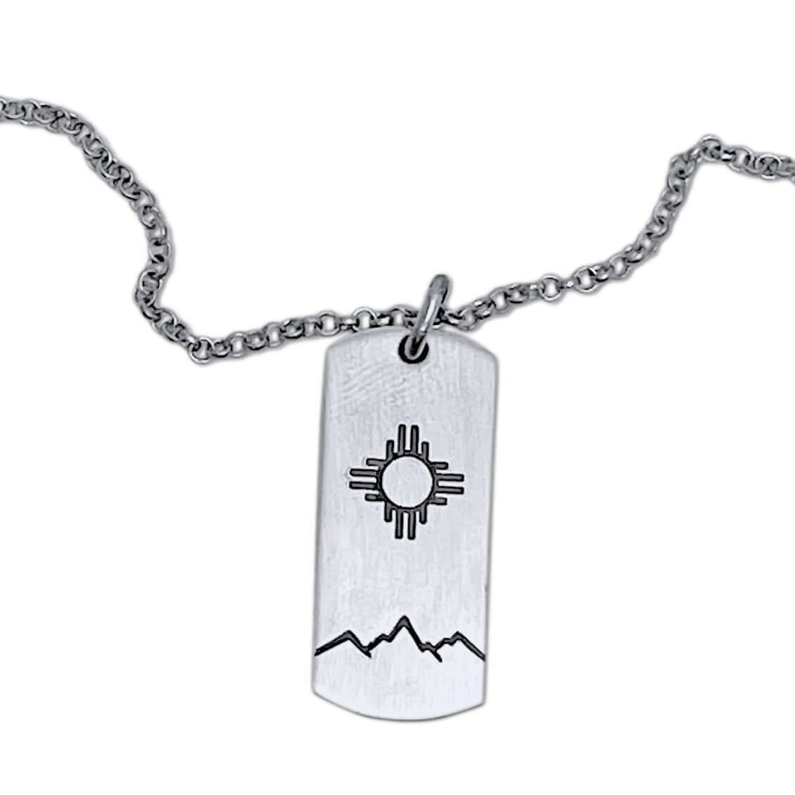 Sol Necklace showcasing Zia sun design etched on a silver pendant, perfect accessory for any outfit.