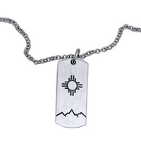 Sol Necklace showcasing Zia sun design etched on a silver pendant, perfect accessory for any outfit.