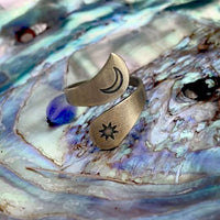 Solar Adjustable Ring featuring a crescent moon and sun design in antique brass finish.