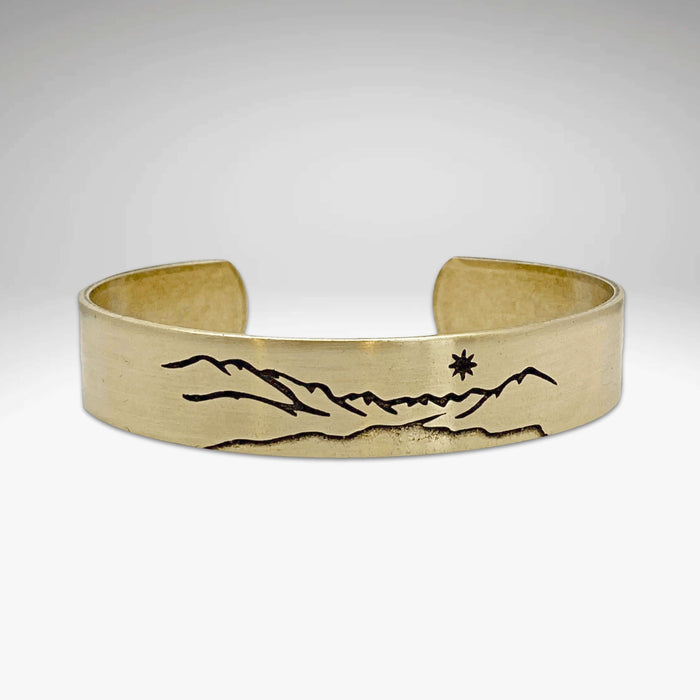 St. Mary Cuff Bracelet featuring mountain and star design, showcasing nature-inspired elegance and adjustable fit.