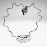 St. Mary Lake in Glacier Necklace featuring a detailed etched pendant on a silver chain.