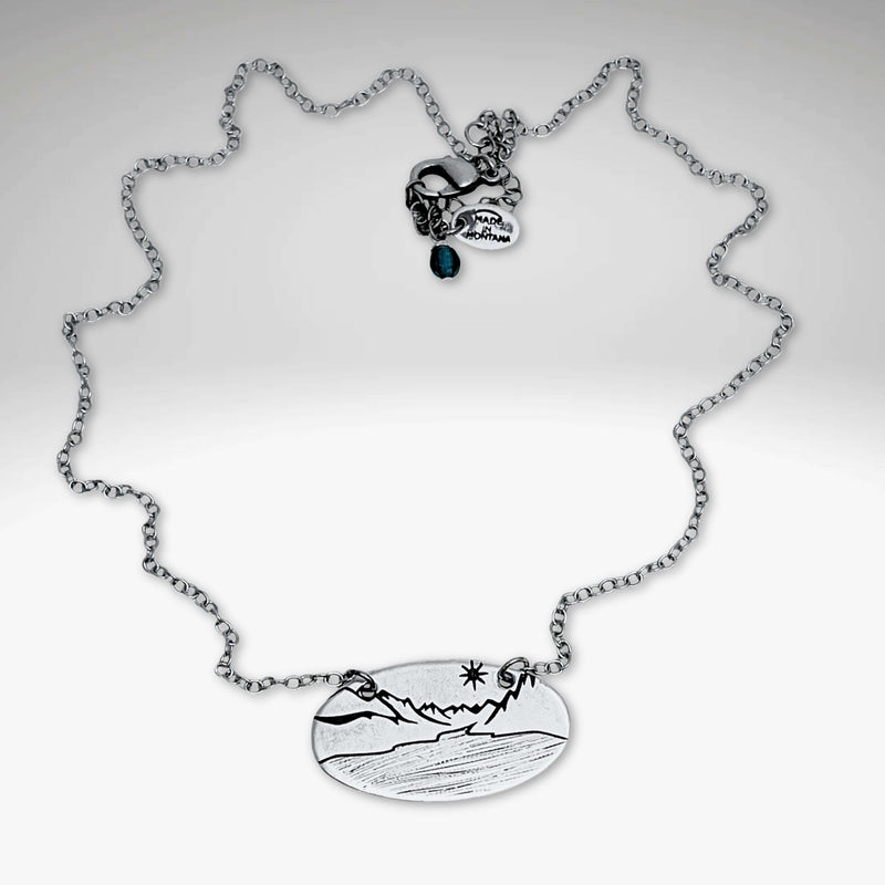 St. Mary Lake in Glacier Necklace featuring a detailed etched pendant on a silver chain.