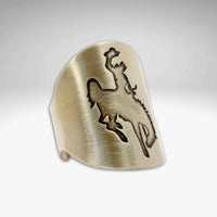 Steamboat Adjustable Ring featuring a bronco design etched in raw brass with a unique finish.