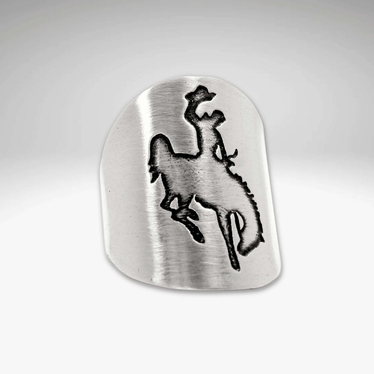 Steamboat Adjustable Ring featuring a bronco rider design etched in brass.