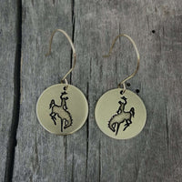 Steamboat Earrings featuring a bucking bronco design etched on matte silver round disks.