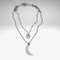 Sun and Moon Long Layered Necklace featuring a hammered crescent moon and small sun in matte silver finish.