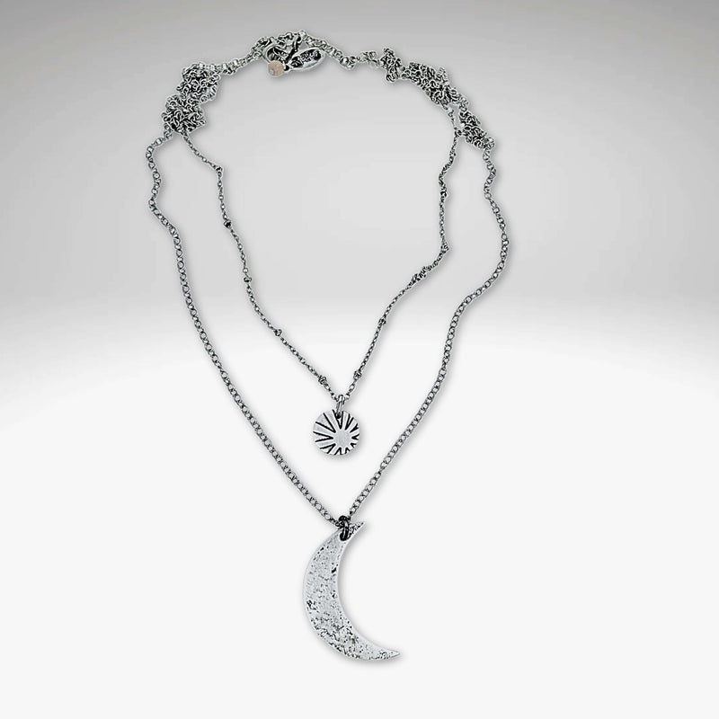 Sun and Moon Long Layered Necklace featuring a hammered crescent moon and small sun in matte silver finish.