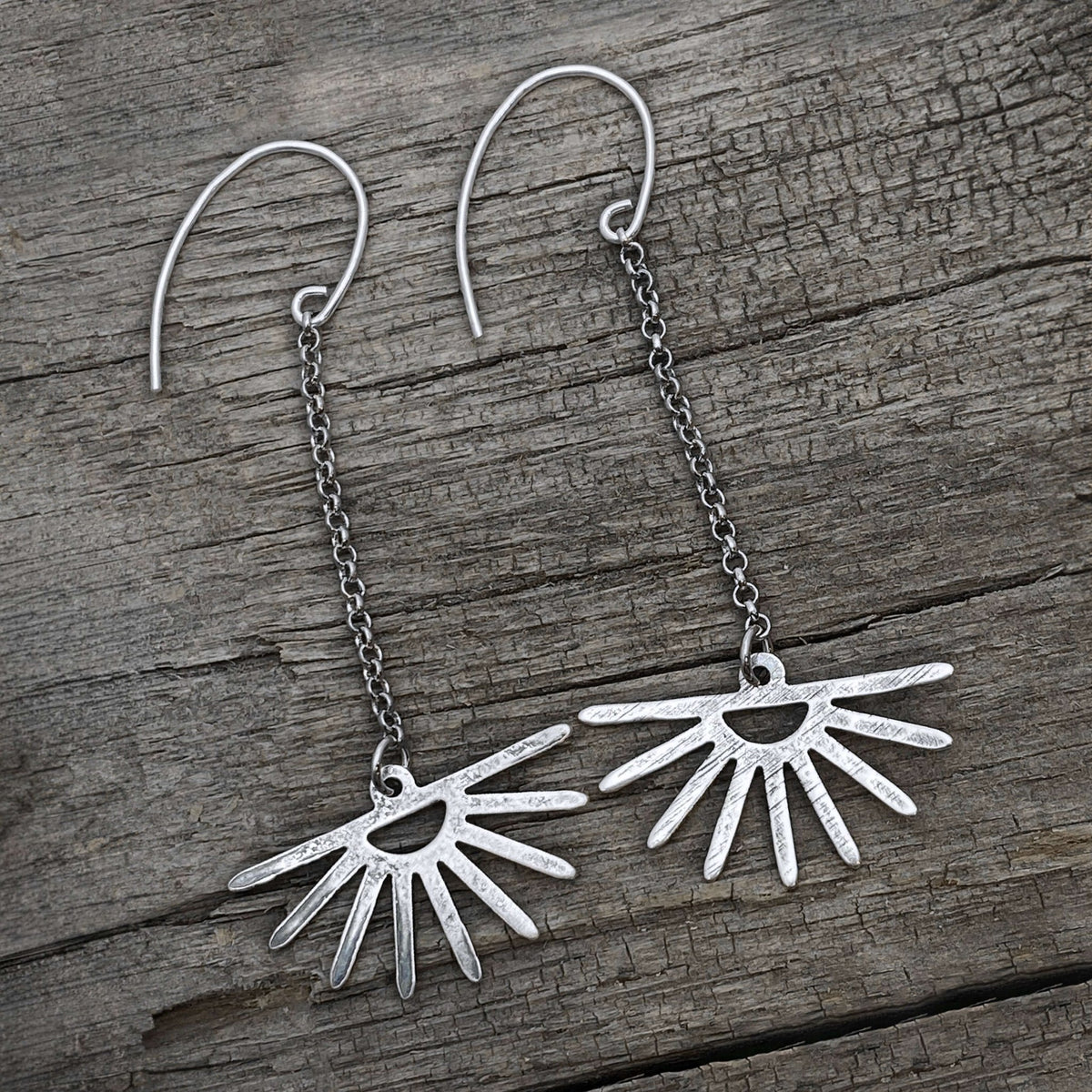 Sunbeam Earrings showcasing delicate sun ray design with chains, radiant and lightweight accessory for any occasion.