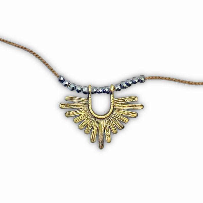 Sunbeam Necklace featuring geometric design, hematite beads, and adjustable silk cord from 16" to 18".