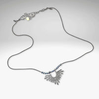 Sunbeam Necklace featuring a geometric pendant on a delicate silk cord with hematite beads, adjustable from 16" to 18".
