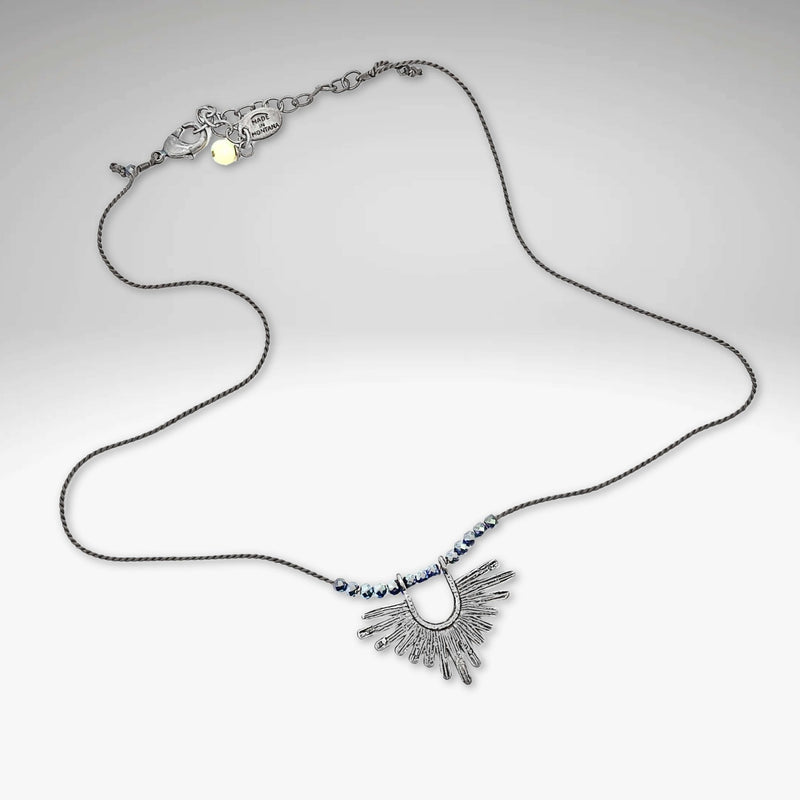 Sunbeam Necklace featuring a geometric pendant on a delicate silk cord with hematite beads, adjustable from 16" to 18".