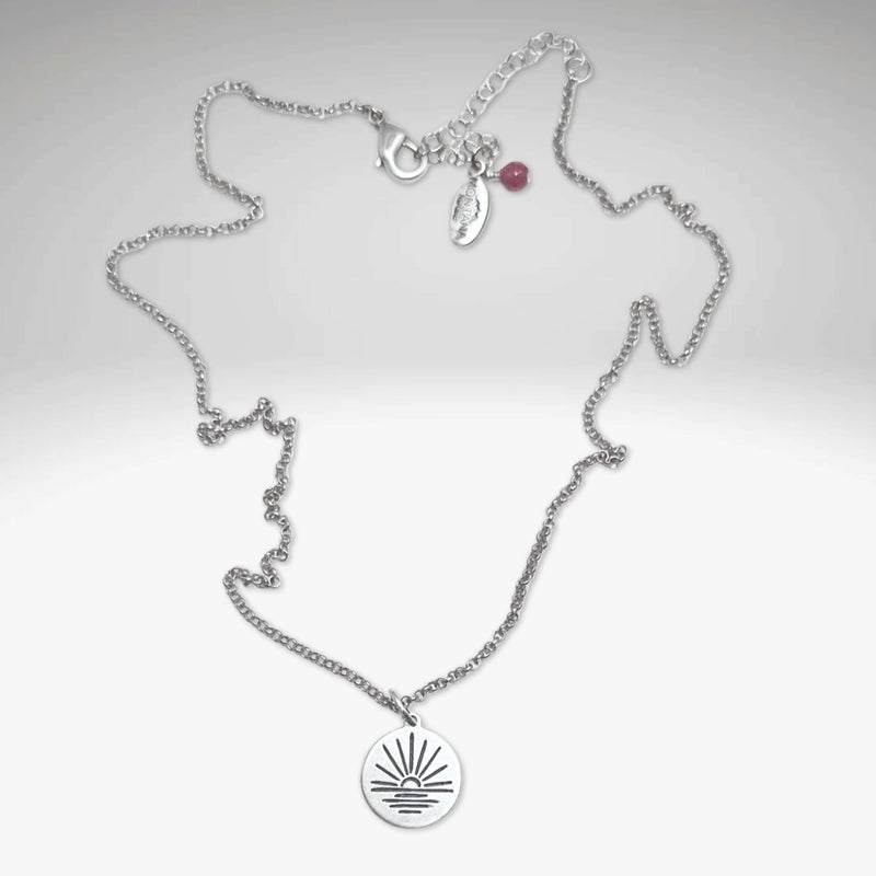 Sunrise Necklace featuring a stunning sunrise pendant on an adjustable chain, perfect for any outfit.