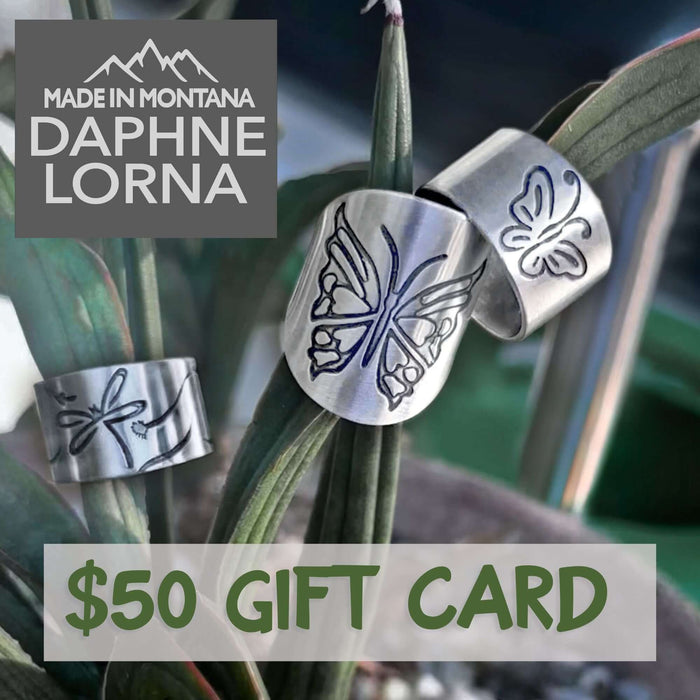 The dL Gift Card featuring $50 design with butterfly artwork and made in Montana branding.